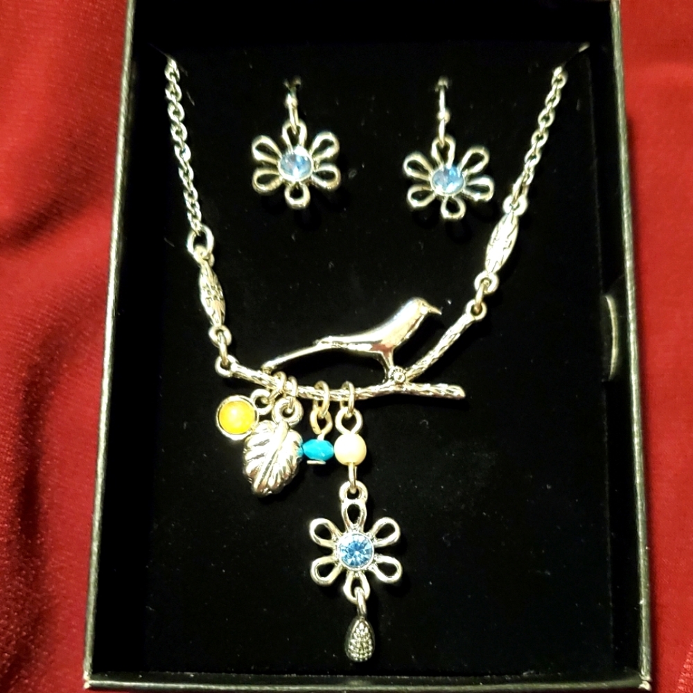 Matching necklace and pierced earrings. Never worn.